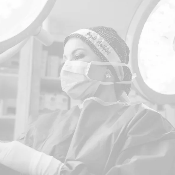 Doctor Bayati protective mask and safety goggles in operating room during medical procedure