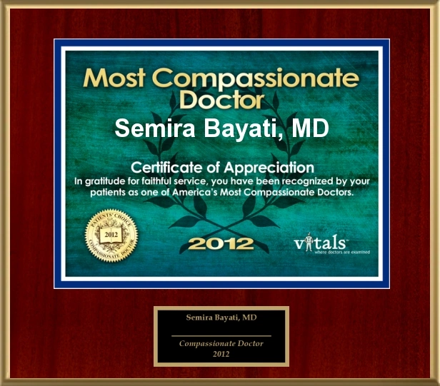 Award plaque recognizing Dr. Semira Bayati as Most Compassionate Doctor 2012 by Vitals, mounted on wood background