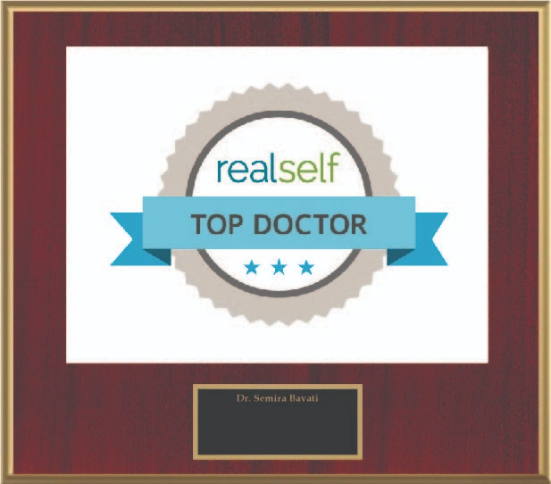 RealSelf Top Doctor award plaque with blue ribbon and stars on burgundy frame